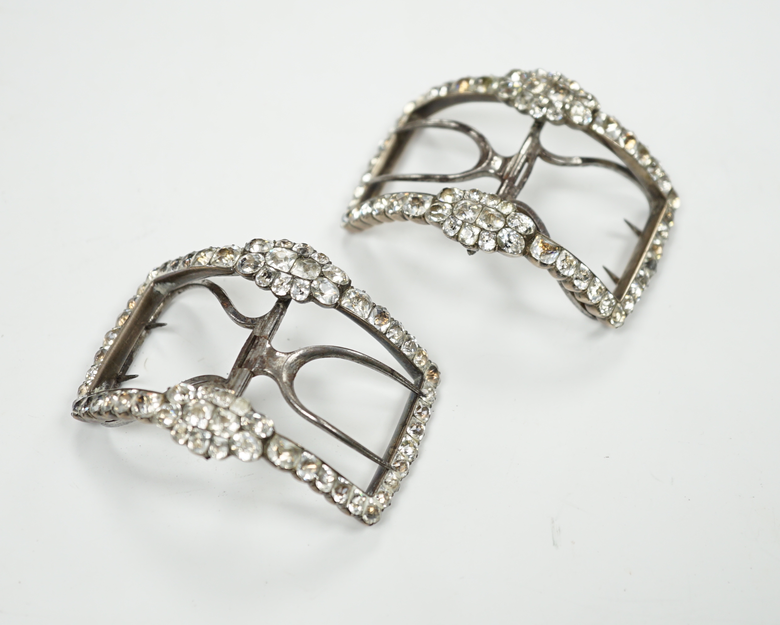 A cased pair of Georgian white metal, steel and white paste cluster set shoe buckles, 58mm, in original box